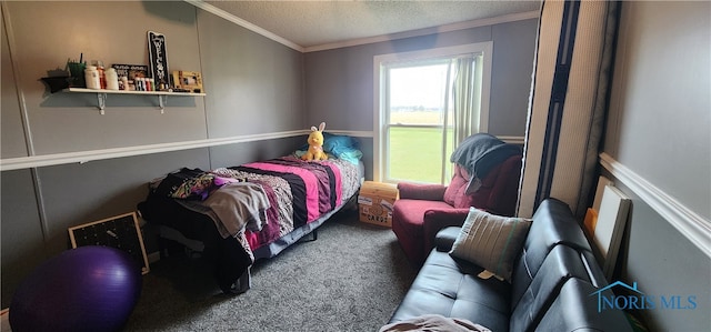 carpeted bedroom with a textured ceiling and ornamental molding