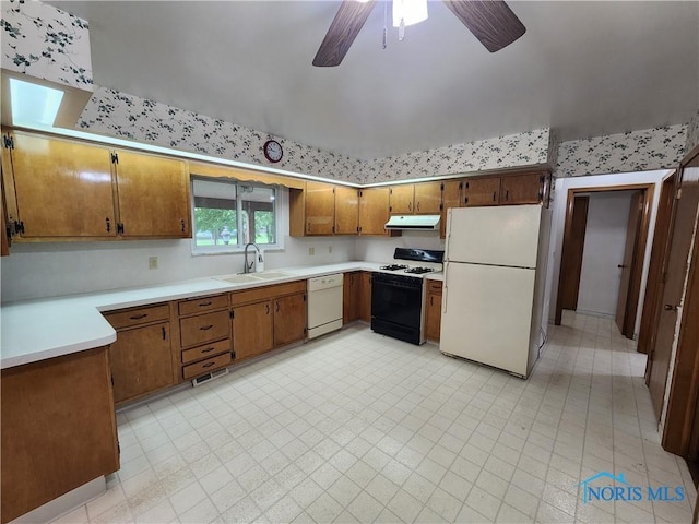 kitchen featuring white appliances, ceiling fan, and sink