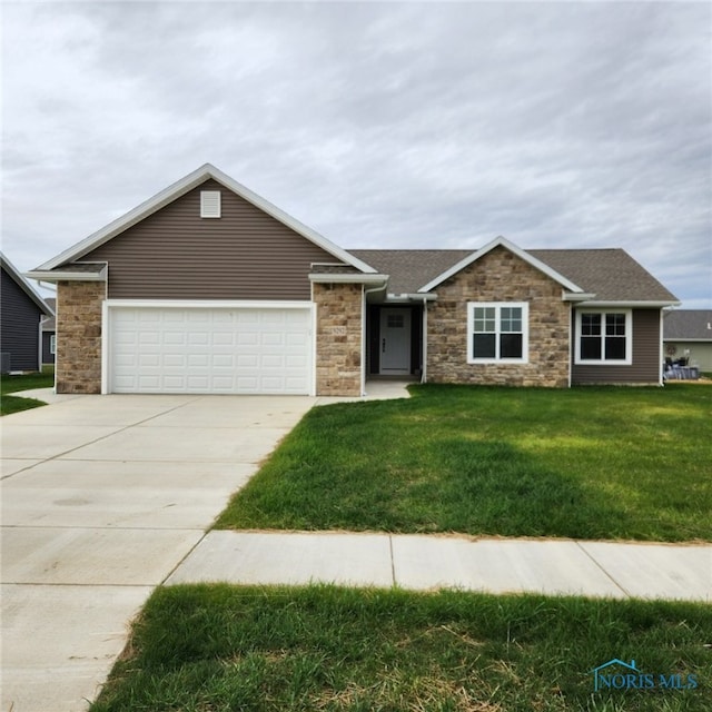 ranch-style home featuring a garage and a front lawn