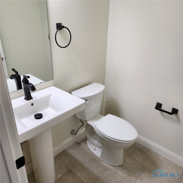 bathroom featuring tile patterned floors and toilet