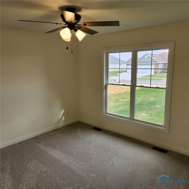 empty room with carpet floors and ceiling fan