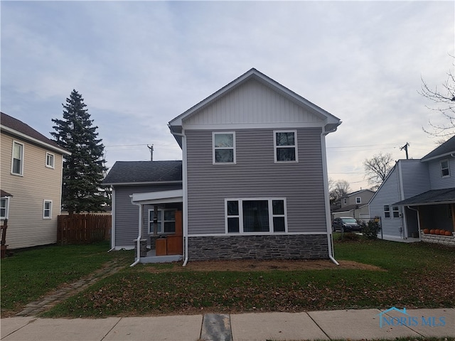 view of front of property with a front lawn