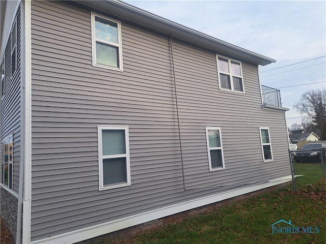 view of property exterior featuring a balcony