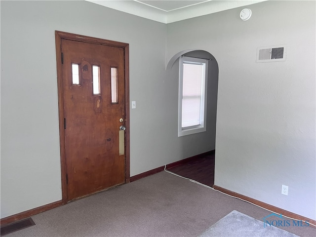 view of carpeted entrance foyer