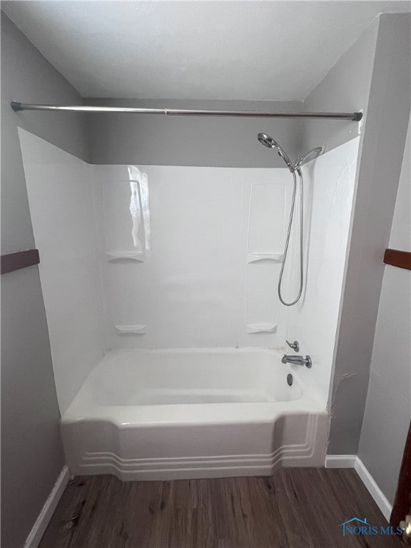 bathroom featuring shower / tub combination and hardwood / wood-style floors