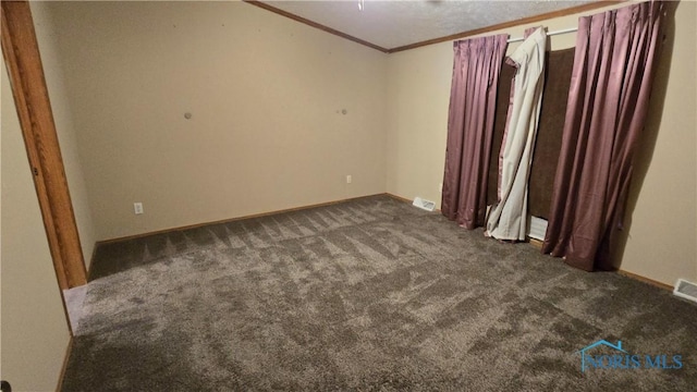 carpeted empty room with ornamental molding