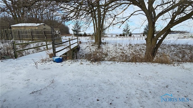 view of yard layered in snow