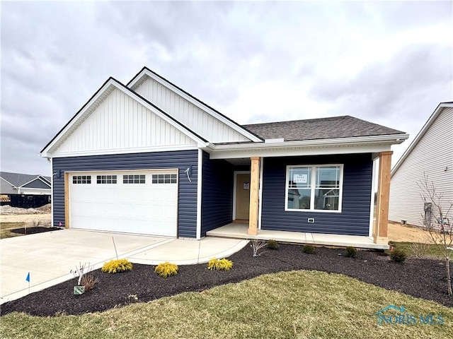 view of front of home featuring a garage and covered porch