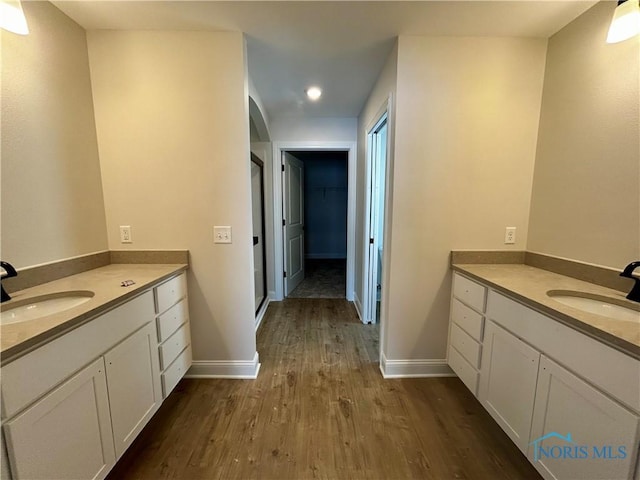 bathroom with vanity and hardwood / wood-style floors