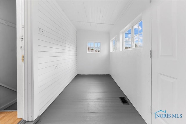 hall with dark hardwood / wood-style flooring