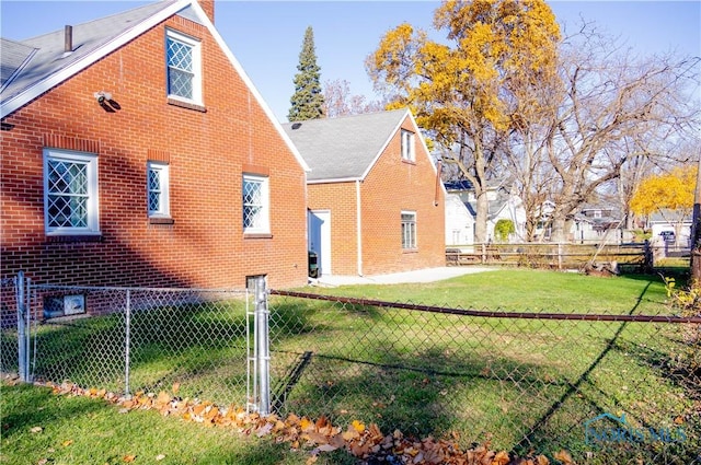 rear view of house with a yard