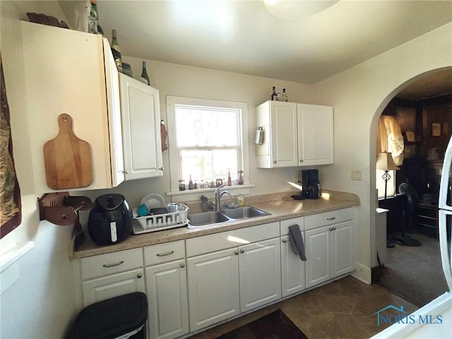 kitchen with white cabinets and sink