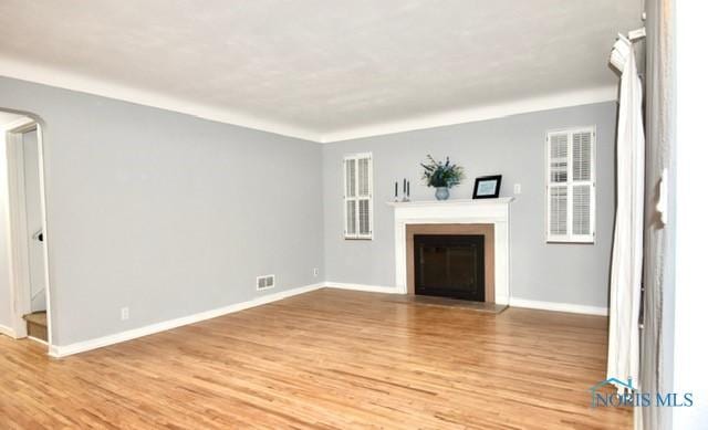 unfurnished living room with light wood-type flooring