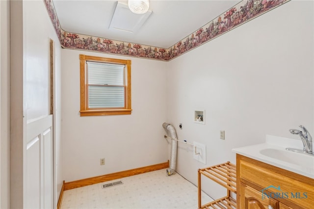 laundry area with hookup for a washing machine, hookup for a gas dryer, electric dryer hookup, and sink