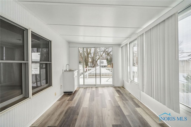 sunroom / solarium featuring plenty of natural light