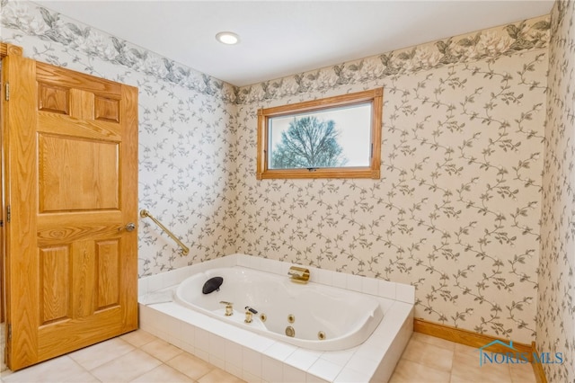 bathroom with tile patterned flooring and tiled bath