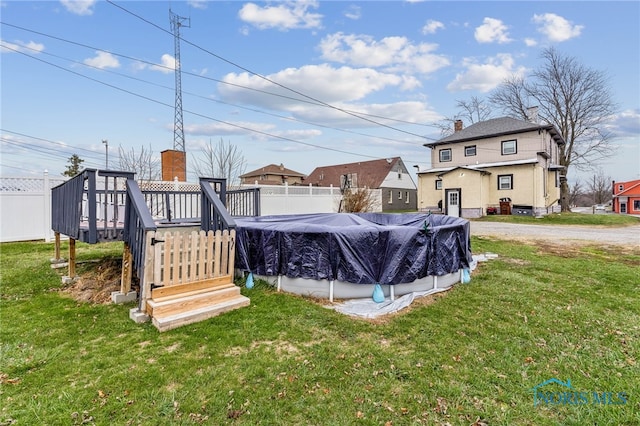 view of yard with a pool side deck