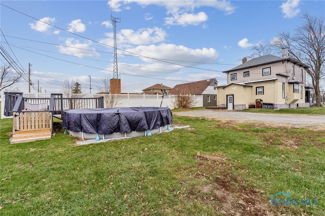 view of yard featuring a covered pool