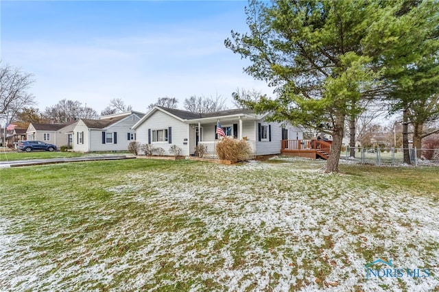 single story home featuring covered porch and a front lawn