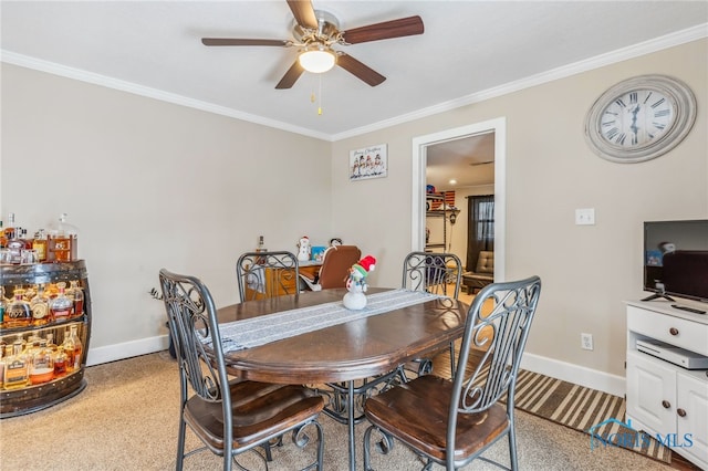 dining room with ceiling fan and crown molding