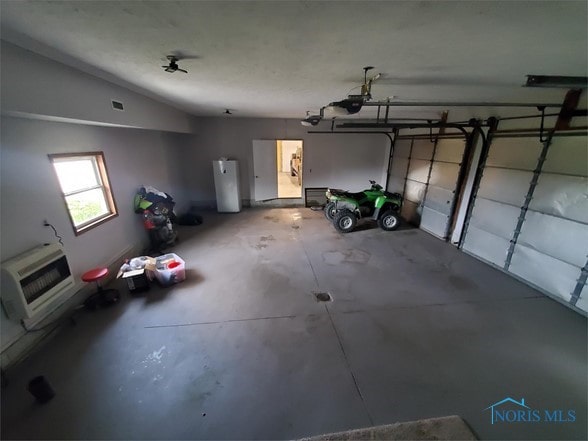 garage with heating unit and a garage door opener