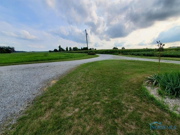 view of street featuring a rural view and a water view