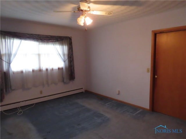 empty room with carpet flooring, ceiling fan, and baseboard heating