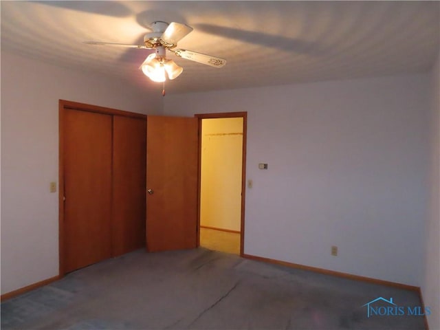 unfurnished bedroom with carpet floors, a closet, and ceiling fan