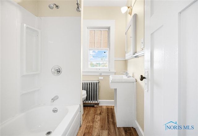 1919 Brookwood Ave, Toledo, OH 43604 - full bathroom with hardwood / wood-style floors, vanity, toilet, shower / bath combination, and radiator heating unit