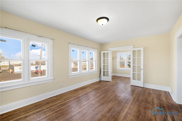 1919 Brookwood Ave, Toledo, OH 43604 - unfurnished room with dark hardwood / wood-style floors, a wealth of natural light, and french doors