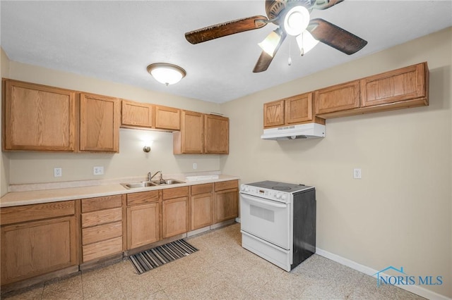 kitchen with electric range, ceiling fan, and sink