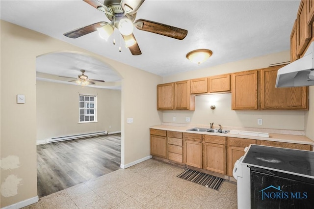 kitchen with a baseboard heating unit, sink, ceiling fan, light hardwood / wood-style floors, and white range oven