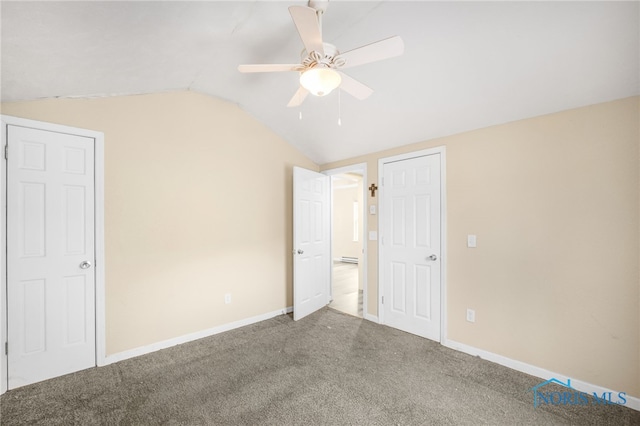 unfurnished bedroom featuring ceiling fan, carpet, and vaulted ceiling