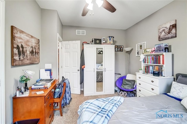 bedroom with light carpet and ceiling fan