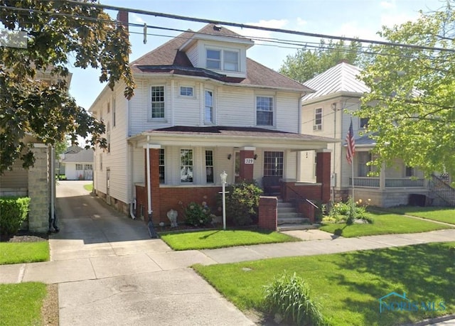 view of front of home featuring covered porch and a front yard