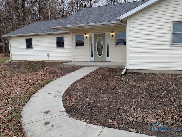 property entrance with covered porch