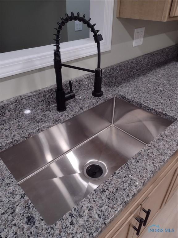 details with light stone counters and sink