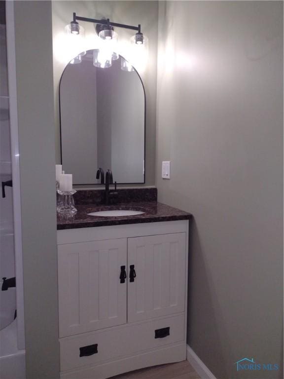 bathroom featuring hardwood / wood-style floors and vanity