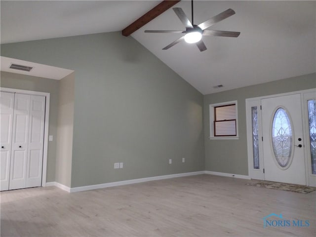 foyer entrance with ceiling fan, lofted ceiling with beams, and light wood-type flooring