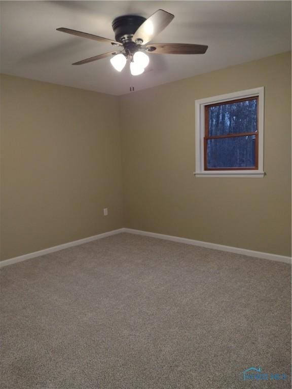 spare room with carpet flooring and ceiling fan