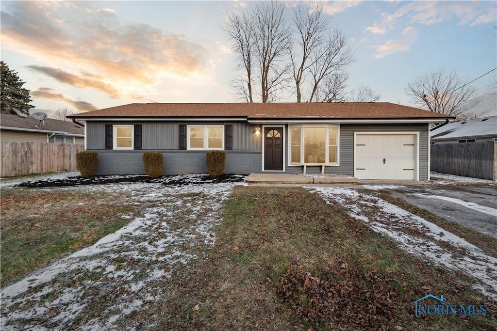 single story home with a garage