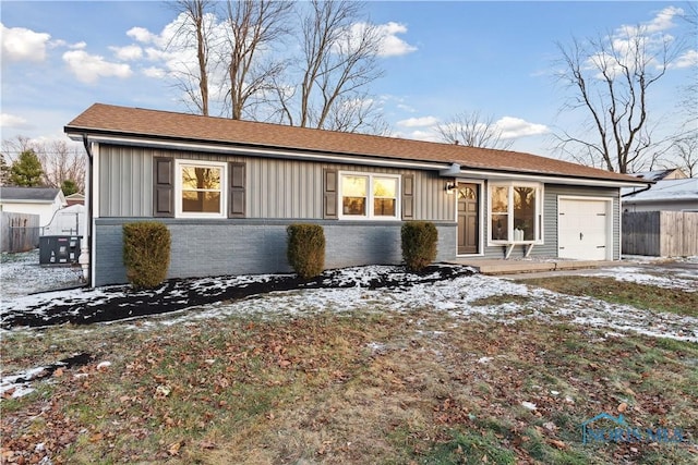 ranch-style home featuring a garage