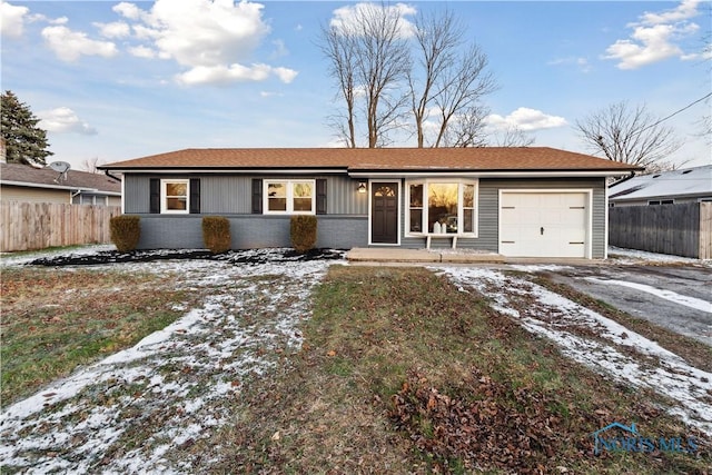 ranch-style house featuring a garage