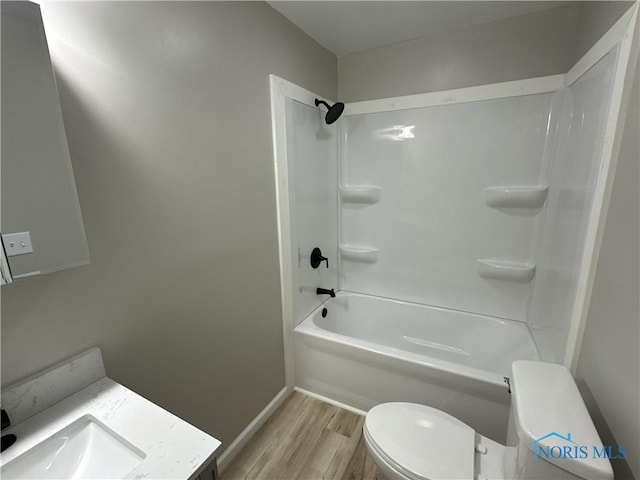 full bathroom with hardwood / wood-style floors, vanity, toilet, and bathtub / shower combination