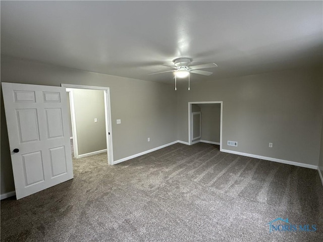 carpeted empty room with ceiling fan