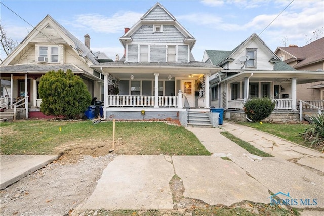 view of front facade with a porch and a front yard