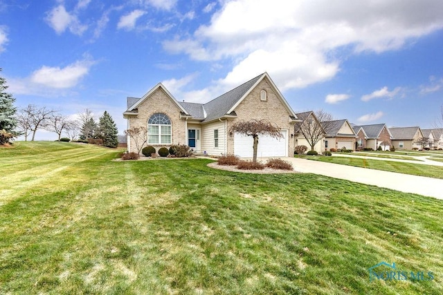 view of front of home featuring a garage and a front lawn