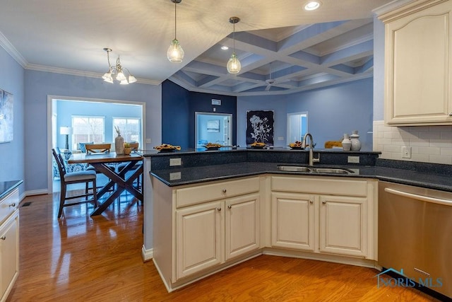 kitchen with pendant lighting, dishwasher, sink, coffered ceiling, and light hardwood / wood-style flooring