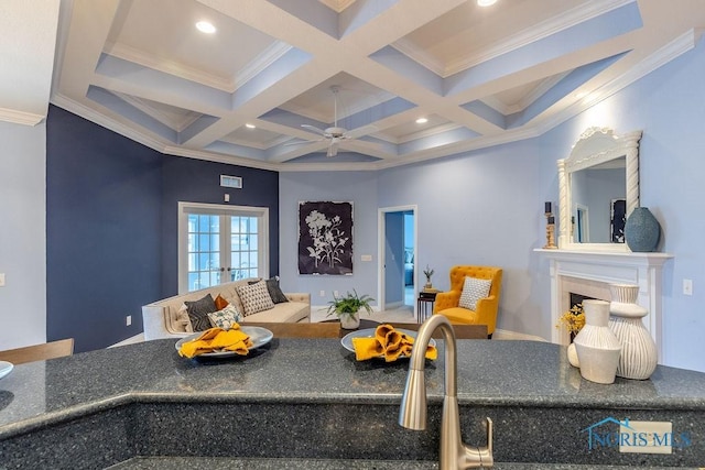 playroom featuring coffered ceiling, ornamental molding, and beam ceiling