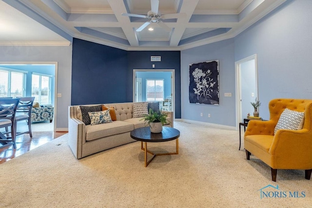 living room featuring coffered ceiling, beam ceiling, ornamental molding, and a healthy amount of sunlight